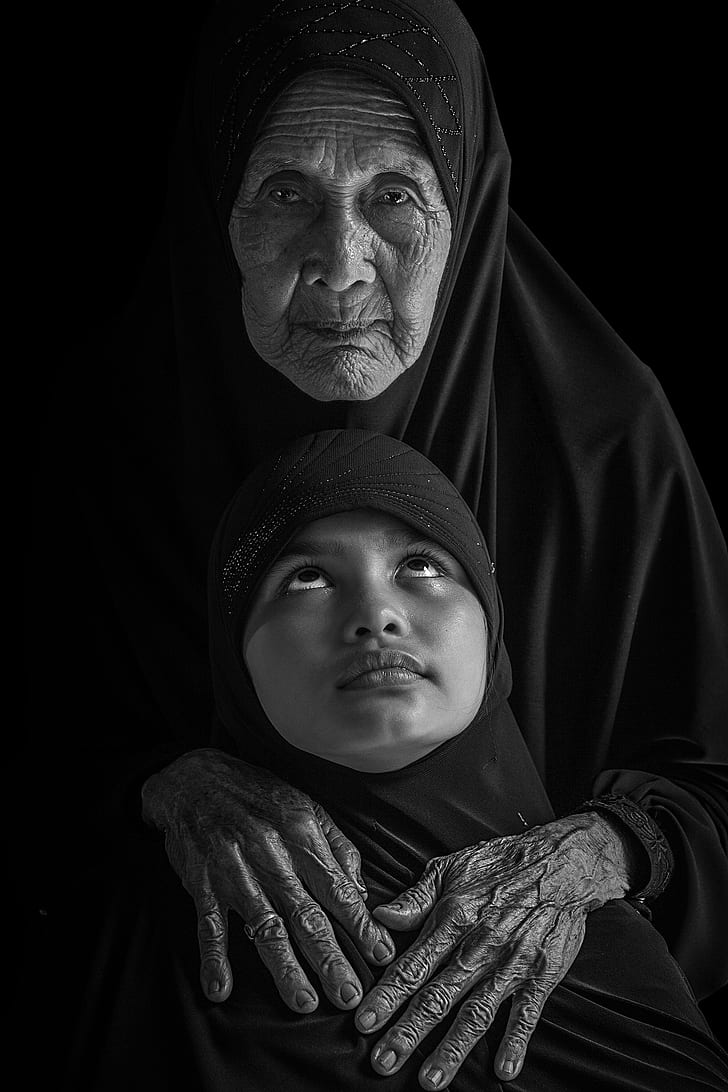 grayscale photo of woman and girl wearing black headscarves