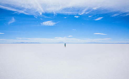 time lapse photography of person under white sky