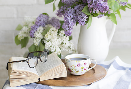 coffee cup, book, and eyeglasses