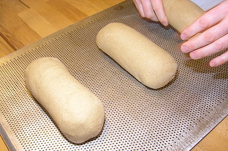 Person Making Brown Bread