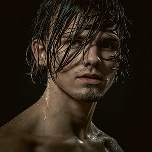 topless man with wet hair