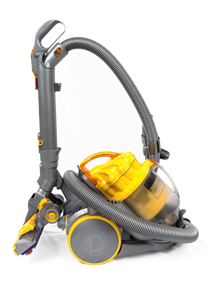 gray and yellow canister vacuum cleaner
