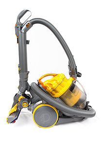 gray and yellow canister vacuum cleaner