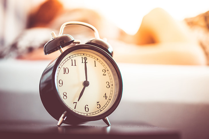 Vintage Alarm Clock and Sleeping Woman