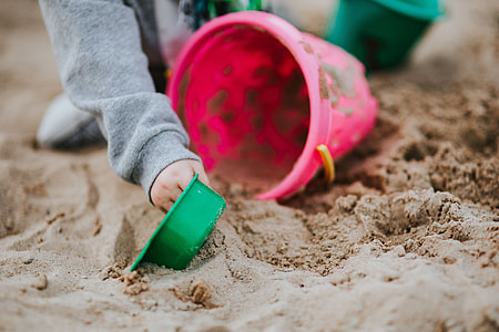 Toddler playing in the sand