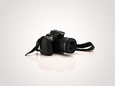 closeup photo of black Nikon DSLR camera