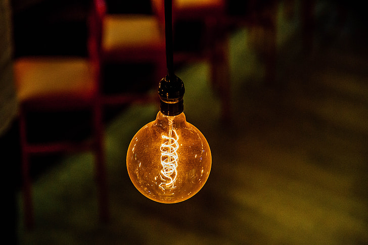 bokeh shot of orange LED light bulb