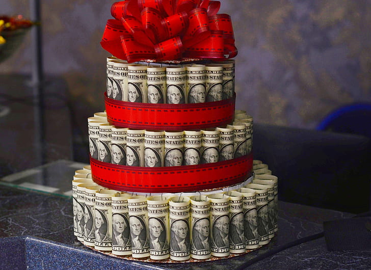US dollar banknote cake on marble table