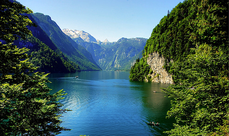 body of water surround by mountains