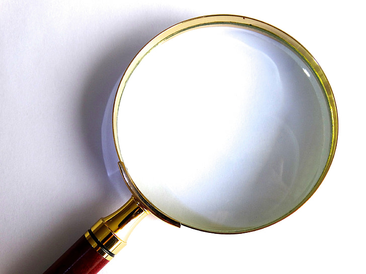 magnifying glass on top of white surface