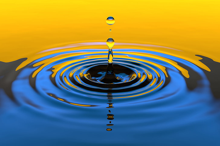 Water droplet splash in yellow and blue