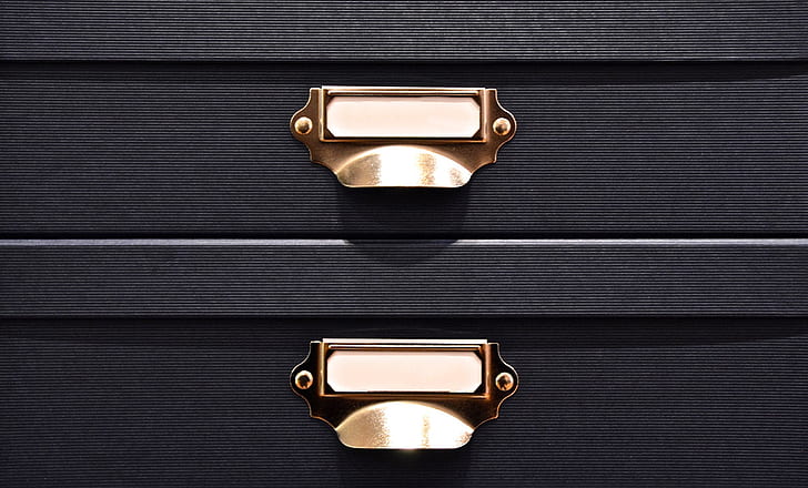 black and brass-colored drawers