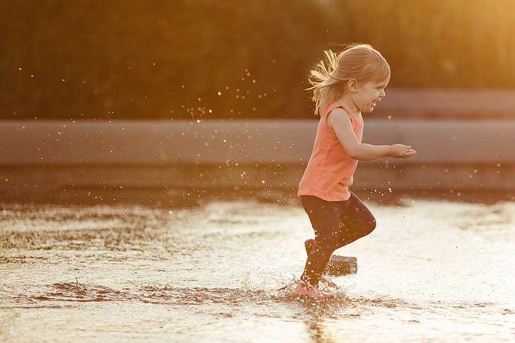 girl playing on water