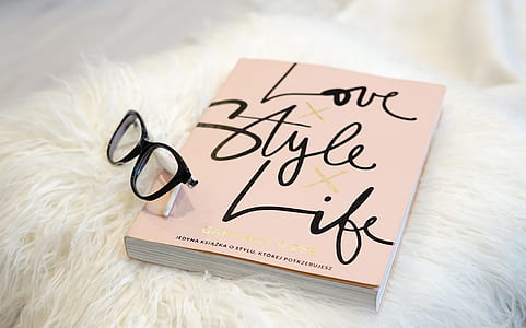 black eyeglasses on Love Style Life book