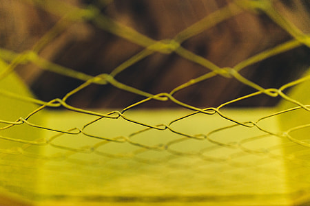 Close-ups of yellow wire netting