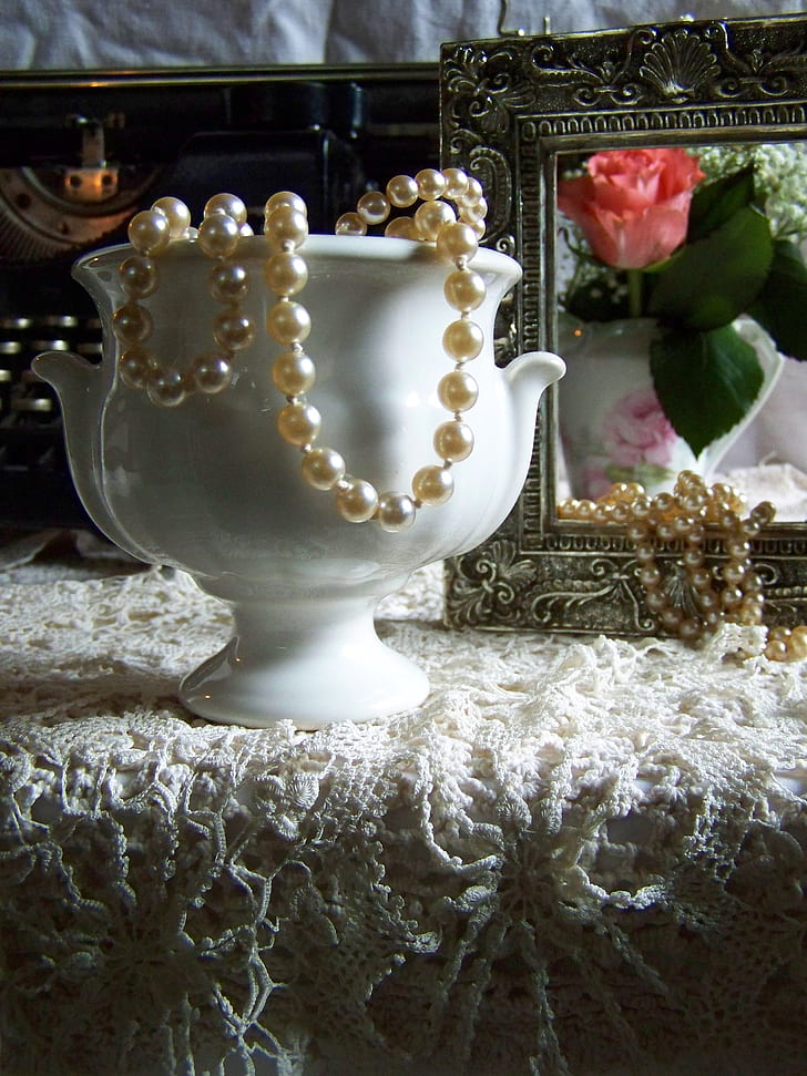 beaded pearl necklace on vase