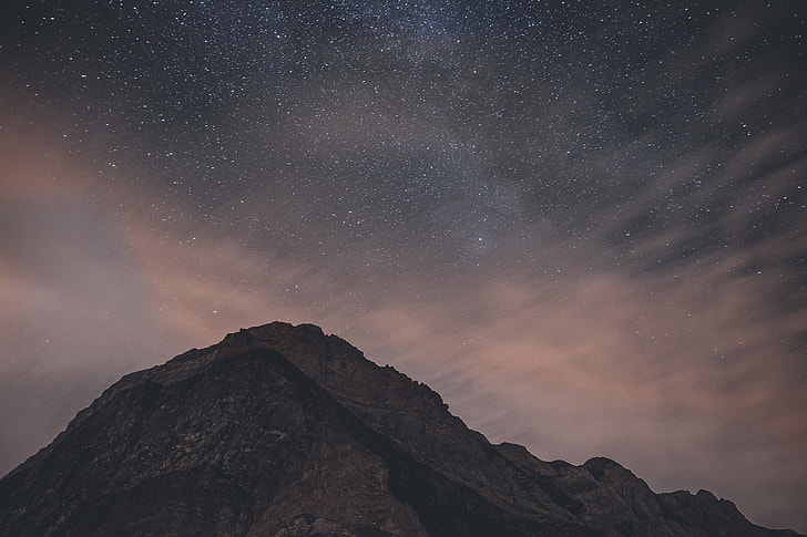 Mountains at night with stars in the sky