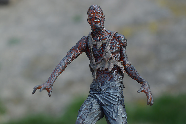 gray and red zombie figure