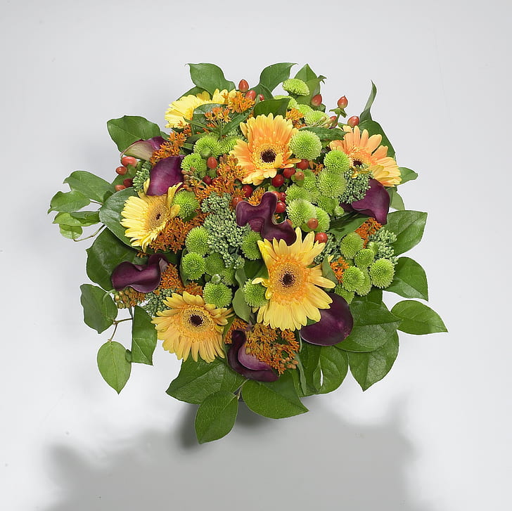 purple, yellow, and green daisies, mums and calla lilies bouquet