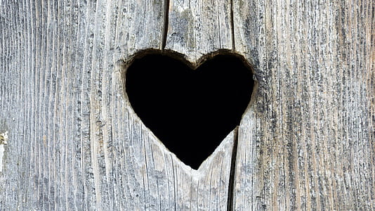 gray wooden plank with heart hole