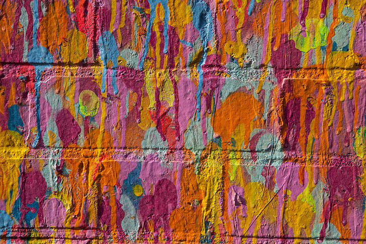 Close-up shot of vibrant multi-coloured on a brick wall in East London, England