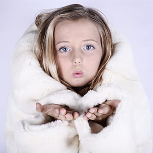 girl wearing white fur coat