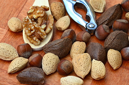 assorted nut lot with nut cracker