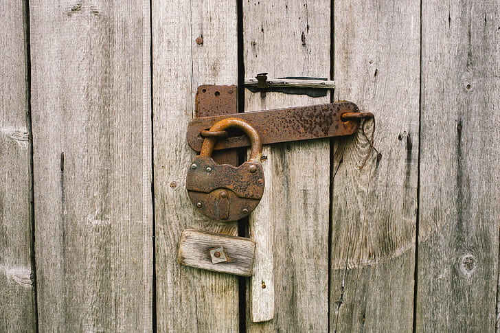 lock padlock on gray door