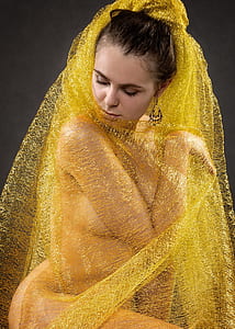 woman wearing yellow lace textile