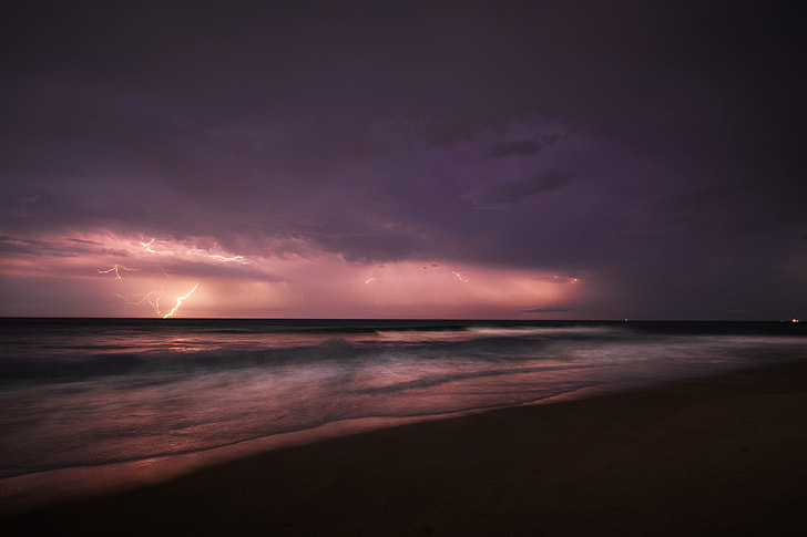 seashore photo during thunder storm