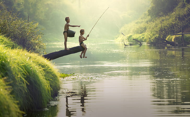 photo of two boys fishing