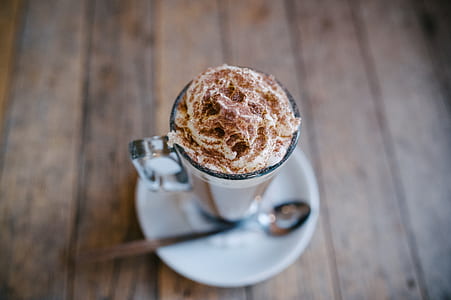 clear glass cup with cappuccino