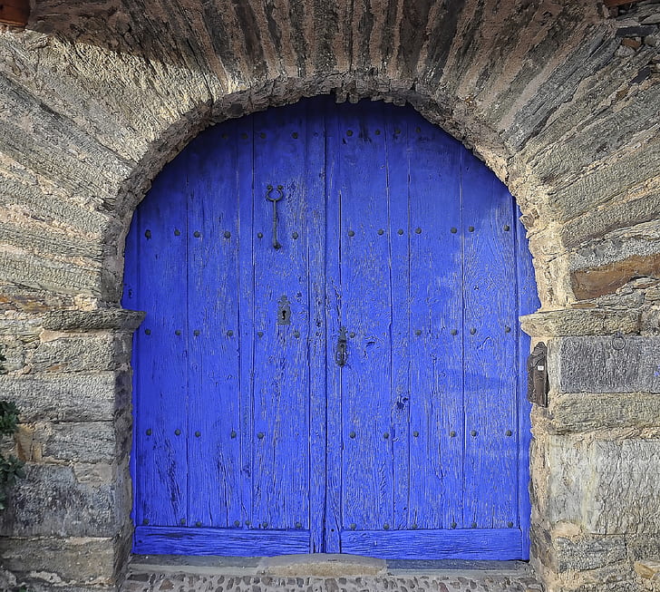 photography of royal-blue wooden window