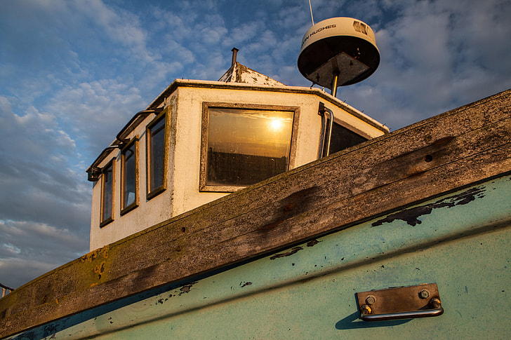 Cropped shot on an old boat on the coast of Dungeness, Kent, England