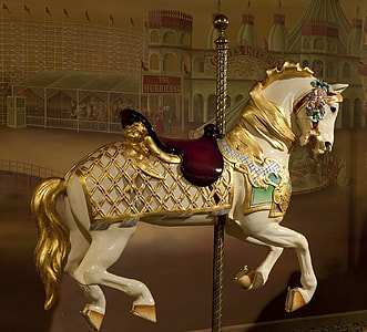 white and yellow horse carousel
