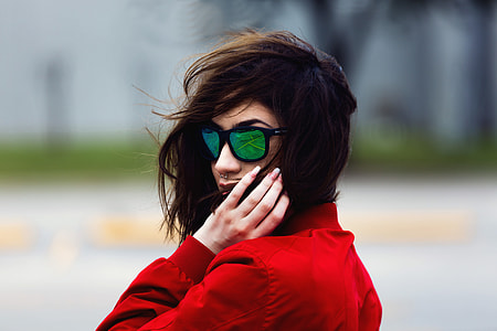 Portrait of woman with long hair wearing sunglasses