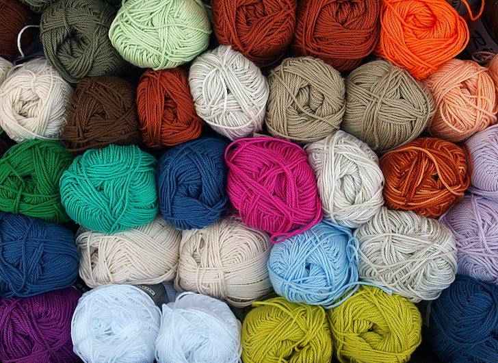 photography of piled rolled yarns