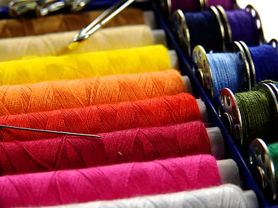 closeup photo of assorted-color of threads