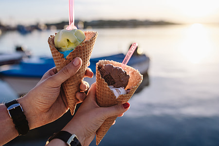 Man and Woman Holding Ice Creams