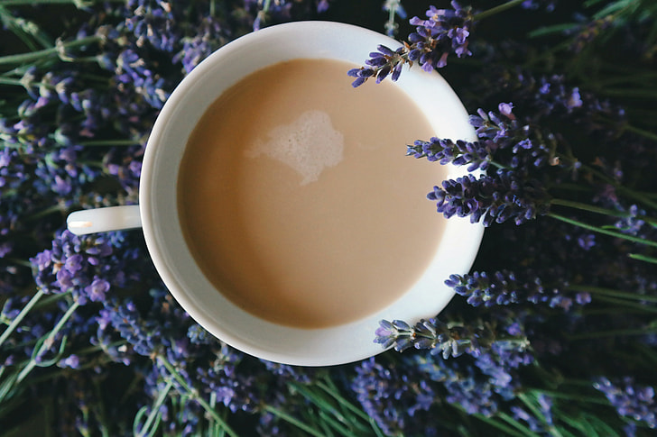 Overhead shot of a cup of tea and flowers