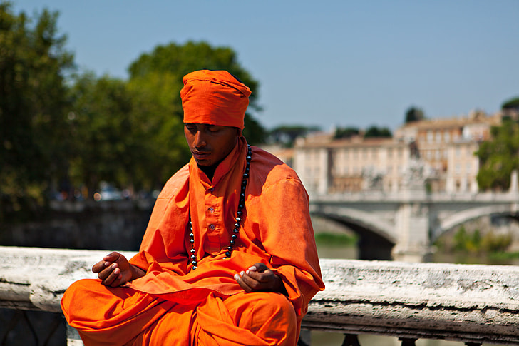 Candid shot of a man in thought and meditation. Image captured on the River Tiber in Rome, Italy