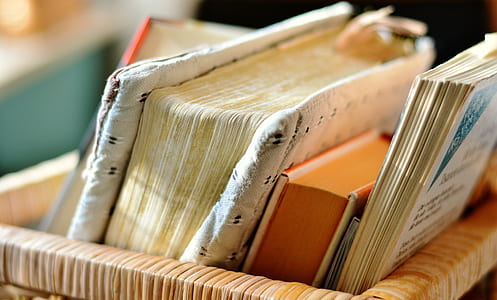 closeup photo of filed books in basket