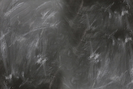 Blackboard and chalk in school classroom