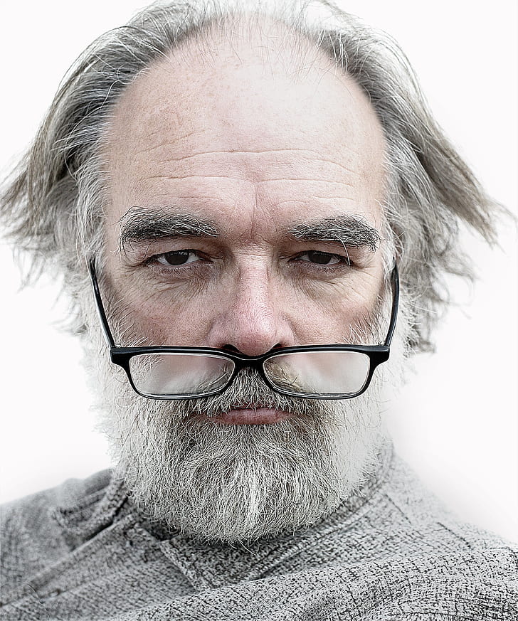 man wearing black framed eyeglasses with white beard