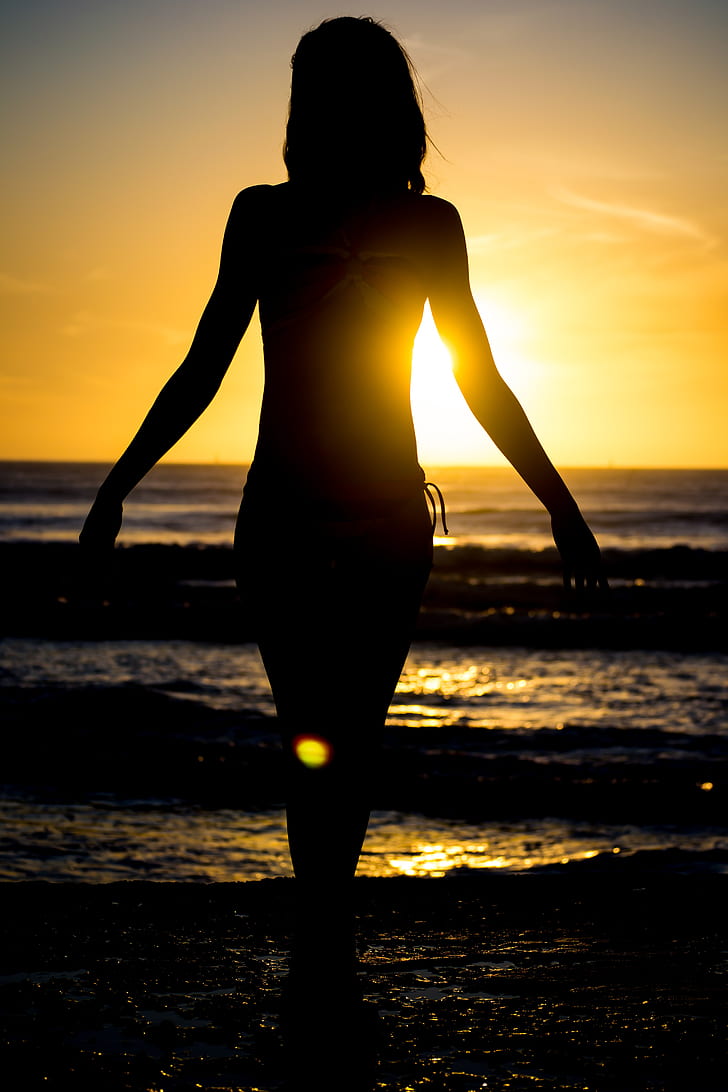woman's silhouette in beach
