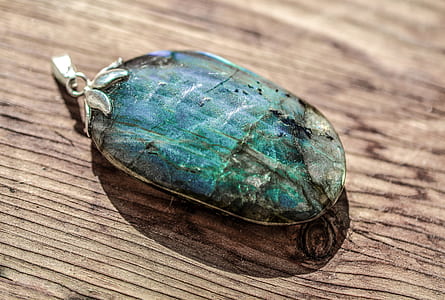 oval blue and black stone pendant