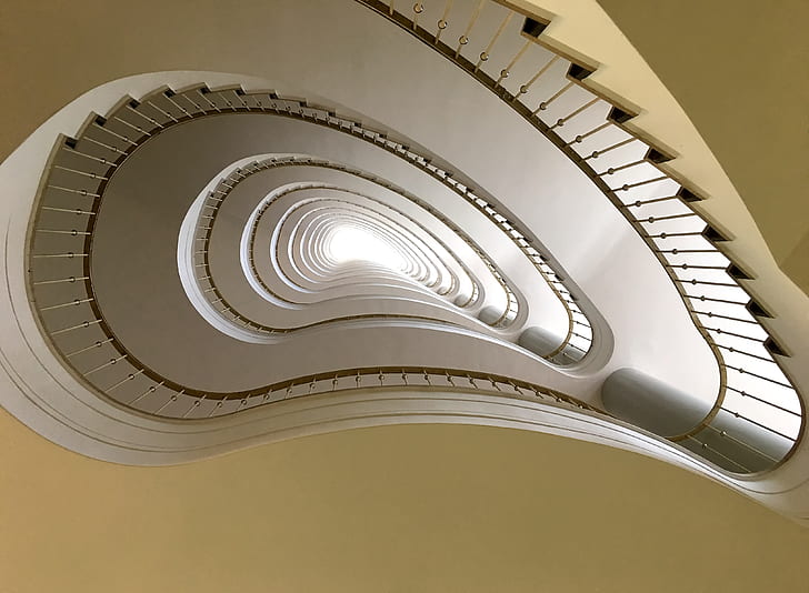 worms eye view of white spiral staircase