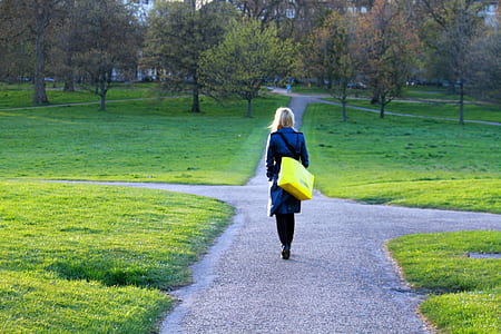 woman walking on the pathway