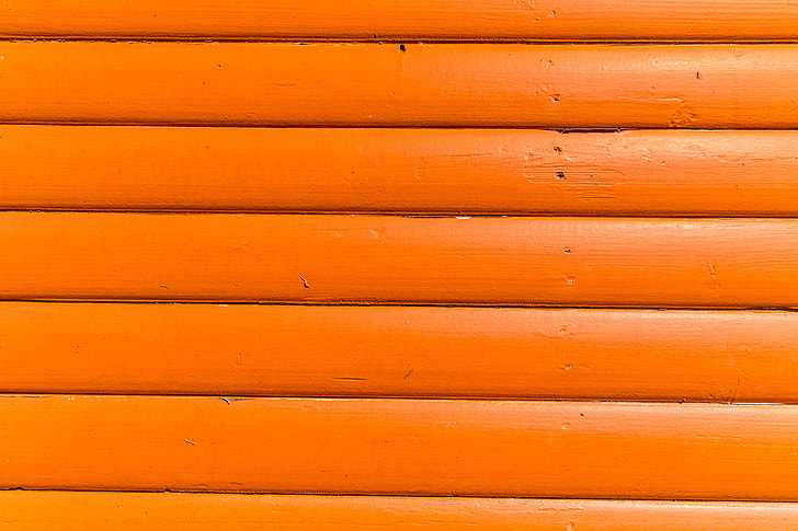 Close-up texture shot of bright orange wood panels. Image captured with a Canon DSLR