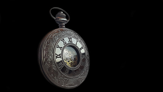 round silver-colored framed pocket watch with black background
